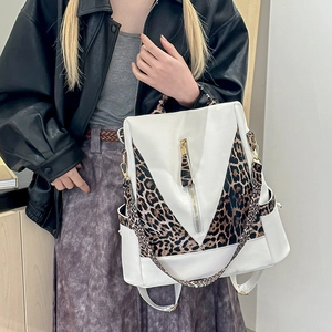Women's chic leopard print backpack with white leather patchwork and gold zipper detail