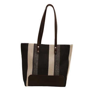Chic oversized canvas tote bag with black and white vertical stripes and leather trim