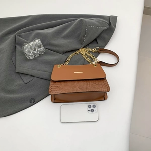 Vintage brown crocodile embossed leather shoulder bag with gold chain and flap closure