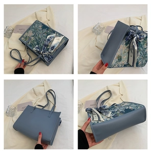 Détails du sac cabas avec jacquard floral vintage et finitions en cuir bleu chic