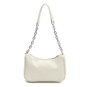 Creamy beige crescent shoulder bag with silver chain and faux leather strap on white background