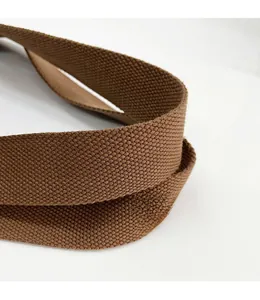 Detailed macro view of the durable brown woven strap with reinforced stitch texture