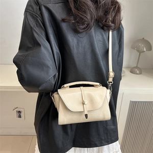 Chic beige crossbody square bag for women with top handle and metal lock detail