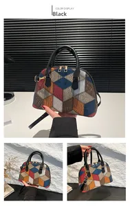 Close-up detail of geometric color block patchwork on a stylish shell handbag with gold hardware