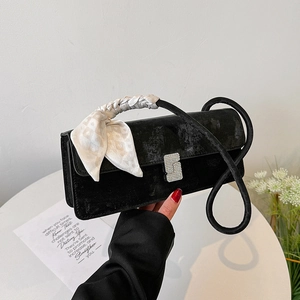 Fashionable black velvet shoulder bag with rhinestone buckle and silk scarf handle