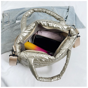 Interior view showing the large storage capacity of a champagne quilted tote bag