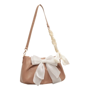 Sweet light brown shoulder bag with large white bow and decorative silk scarf detail