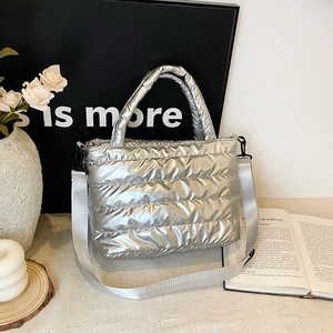Chic silver metallic quilted puffer handbag with wide fabric strap for women