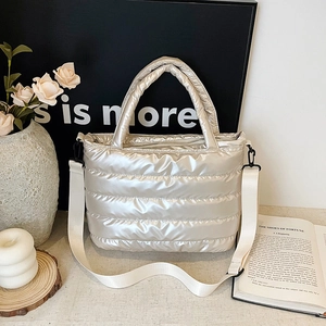 Quilted puffer tote bag in metallic silver with detachable shoulder strap for women