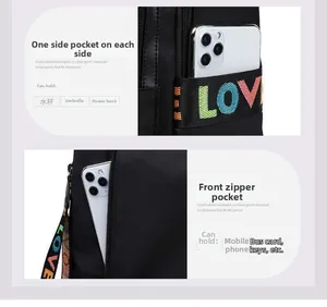 Detail view of Oxford fabric backpack side pockets holding a phone and umbrella