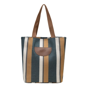 Minimalist striped canvas tote bag with brown leather patch and woven handles for women