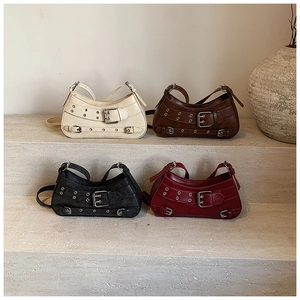 Minimalist faux leather handbags in four colors featuring decorative buckles and metal eyelets