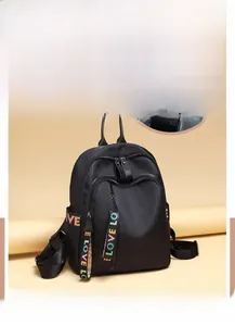 Close-up of waterproof Oxford fabric and LOVE letter embroidery on a black backpack