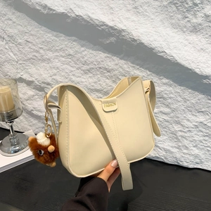 Chic cream-white faux leather bucket bag for women with adjustable strap and cute lamb charm