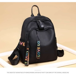 Minimalist black nylon backpack with colorful LOVE letter straps and multi-layer zipper design
