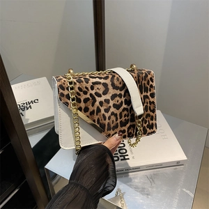 Fashionable leopard print flap crossbody bag with gold chain strap and metal trim