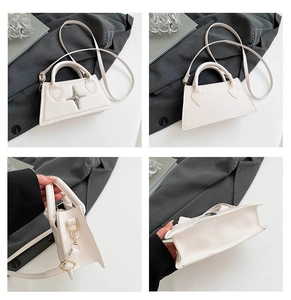 Vue détaillée du mini sac à main blanc en cuir avec étoile et bandoulière réglable