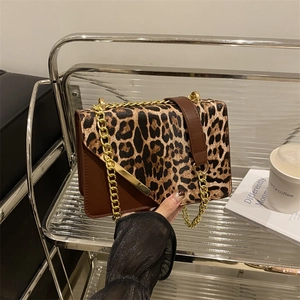 Fashion leopard print crossbody bag with gold chain strap and brown leather accents