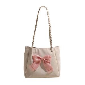 Cremefarbene Shopper Tasche mit rosa Organzaschleife und gewebten Schultergurten
