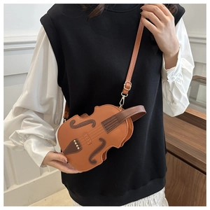 Artistic violin-shaped crossbody bag featuring golden rivets and premium synthetic leather