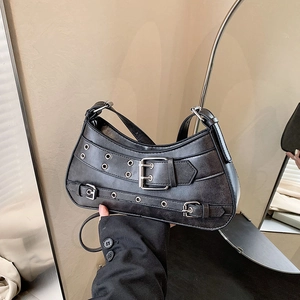 Black vintage leather hobo bag with punk style metal eyelets and decorative straps