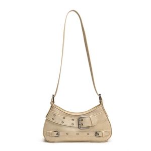 Minimalist beige half-moon shoulder bag with punk silver buckles and metal eyelets