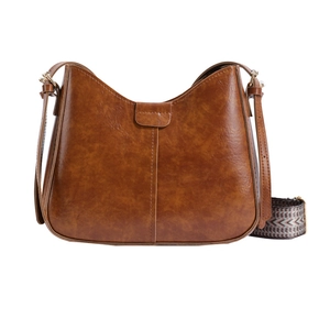 Brown retro bucket bag in PU leather with dual straps and polished finish