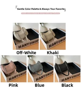 Detailed display of corduroy shoulder bags in five colors with metal chain straps