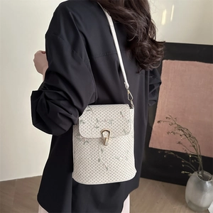 Floral embroidered woven shoulder bag in cream white with delicate green and pink blossoms