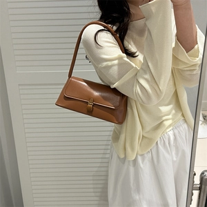 Brown leather rectangular shoulder bag with flap closure and golden metal buckle