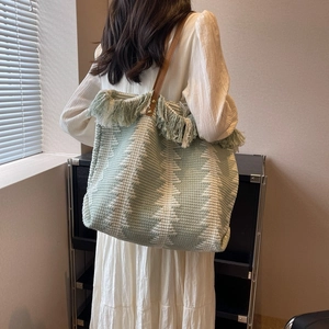 Large capacity woven tote bag with green pine pattern, tassels and brown shoulder strap