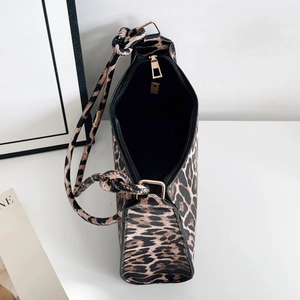 Chic leopard print shoulder bag with adjustable knot strap and gold zipper closure