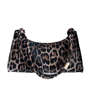 Fashionable leopard print crescent shoulder bag for women with gold metal details