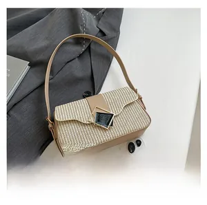 Detailed comparison of crossbody bag size next to a smartphone and accessories