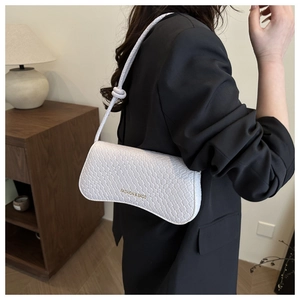 Detail of white woven texture shoulder bag with gold FASHION & BAGS lettering
