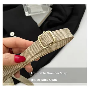 Detail view of beige woven shoulder strap with adjustable golden square metal buckle