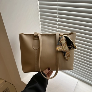 Minimalist large khaki faux leather tote bag with elegant silk scarf and long straps
