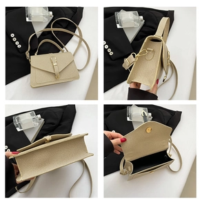 Detail view of champagne gold crossbody bag with textured leather and magnetic closure