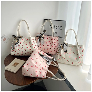 Corduroy tote bags with strawberry and cherry prints and decorative silk scarves