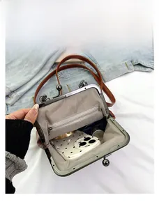 Interior view showing the large capacity and wave pattern lining of the brown vintage bag
