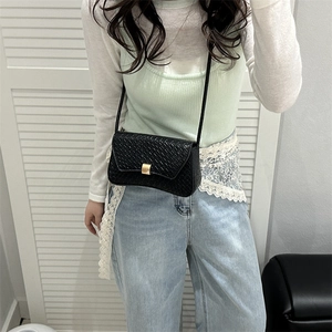 Minimalist black woven texture crossbody bag with gold buckle for women fashion