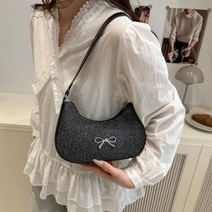 Sparkly black sequin hobo bag with silver bow detail and shoulder strap for women