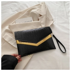Close-up of black water-ripple textured envelope clutch with golden metallic V-edge detail