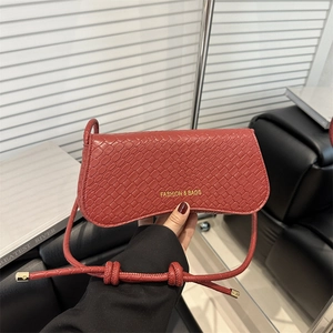 Elegant red woven texture crossbody bag with gold fashion logo and knot strap detailing