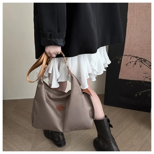 Khaki large-capacity shoulder tote bag with brown leather patch and wide strap