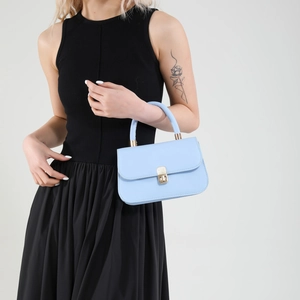Elegant light blue leather handbag with gold metal lock buckle for spring 2025