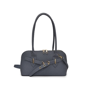 Minimalist dark gray woven shoulder bag with golden hardware and arc handle design