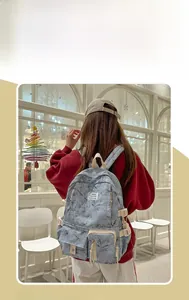 Detail of light blue marble pattern backpack featuring sturdy white side buckles