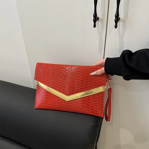 Red envelope clutch bag with water ripple texture and gold V-shaped metal trim detail