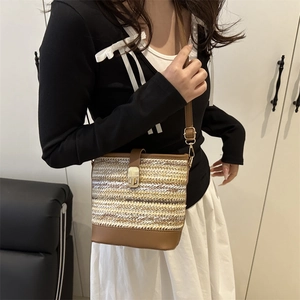 Fashionable woven PU bucket bag for women with beige textures and brown leather straps